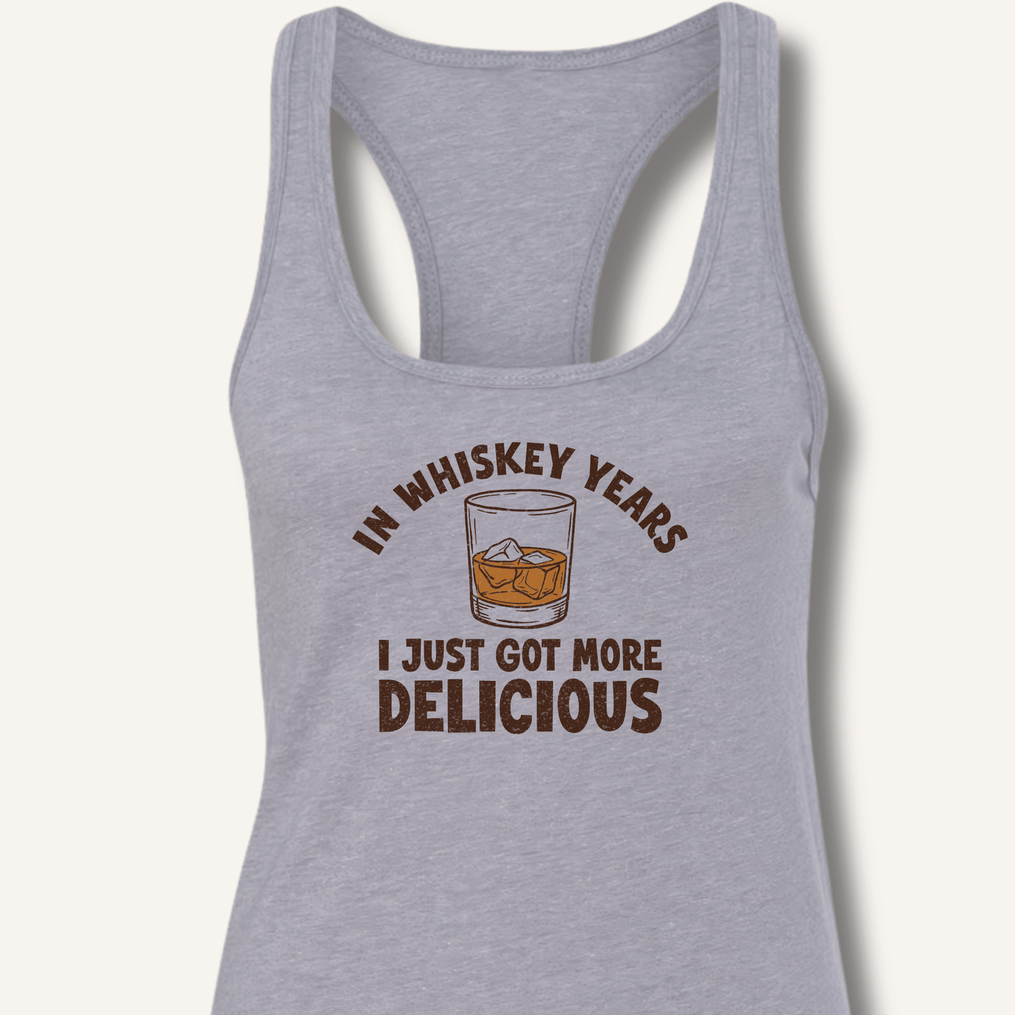 In Whiskey Years I Just Got More Delicious Racerback Tank - Sip & Shirt