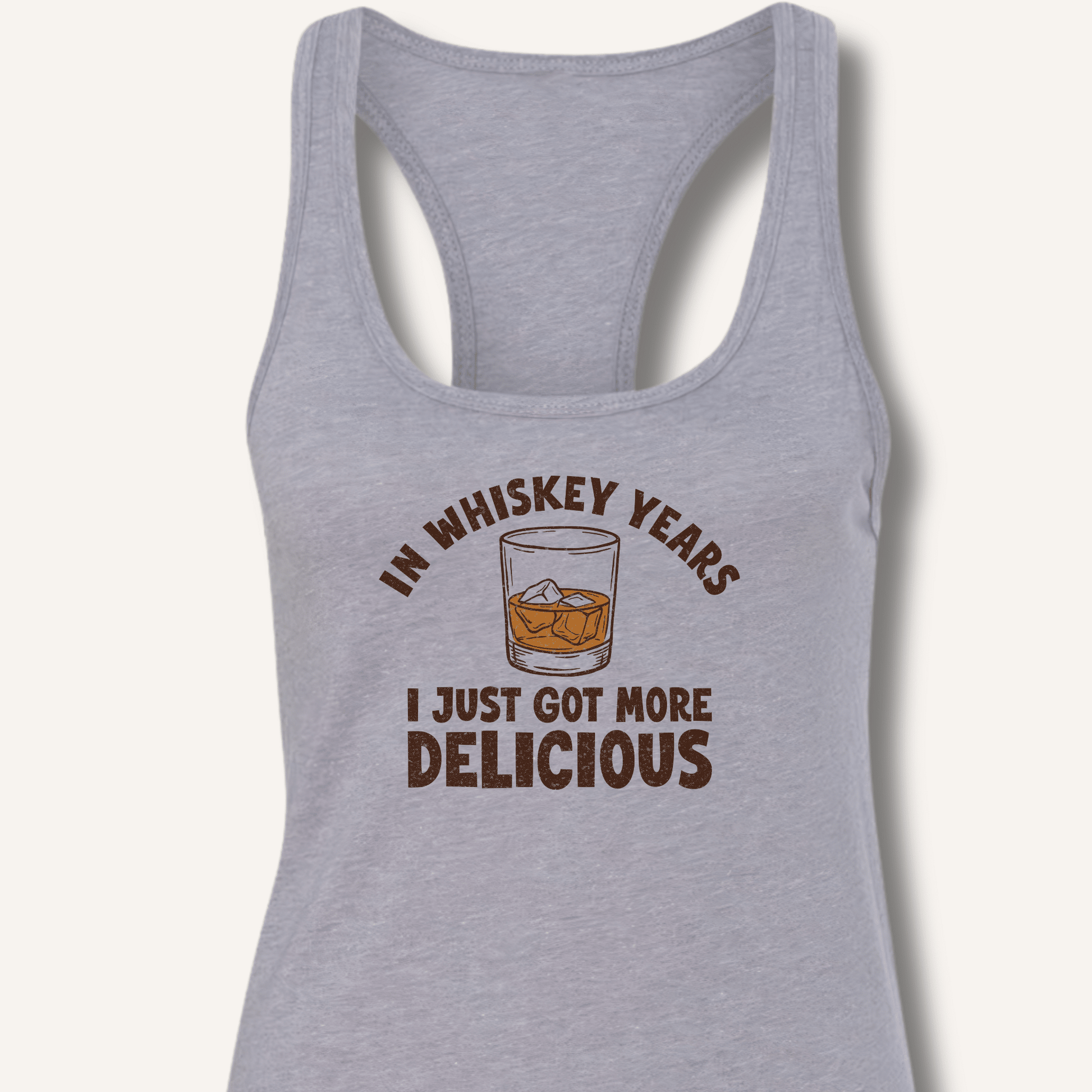 In Whiskey Years I Just Got More Delicious Racerback Tank - Sip & Shirt